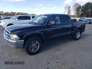 2003 Dodge Dakota SLT with VIN 1D7HL48N03S367805, listed as a Copart auction lot 82282594 with 297,571 mi miles and Salvage Title. Bid and sale history available at carsss.com. Image 1.