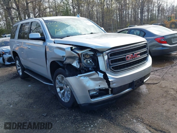 2015 GMC Yukon SLE with VIN 1GKS1AKC8FR540627, listed as a IAAI auction lot 42004023 with 128,195 mi miles. Bid and sale history available at carsss.com. Image 1.