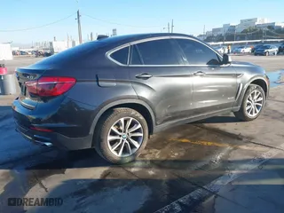 2019 BMW X6 sDrive35i with VIN 5UXKU0C57K0S97581, listed as a IAAI auction lot 41322568 with 76,635 mi miles. Bid and sale history available at carsss.com. Image 4.