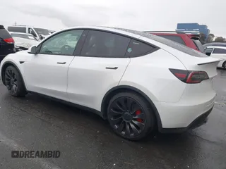 2021 Tesla Model Y Performance with VIN 5YJYGDEF2MF230374, listed as a IAAI auction lot 41708828 with 20,272 mi miles. Bid and sale history available at carsss.com. Image 3.