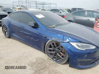 2021 Tesla Model S Plaid with VIN 5YJSA1E64MF442036, listed as a IAAI auction lot 42141304 with 24,998 mi miles and . Bid and sale history available at DreamBid. Image 6.