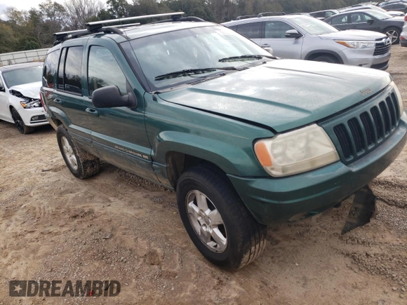 1999 Jeep Grand Cherokee Limited with VIN 1J4GW68S1XC744666, listed as a Copart auction lot 88337895 with 243,480 mi miles and Salvage Title. Bid and sale history available at carsss.com. Image 4.