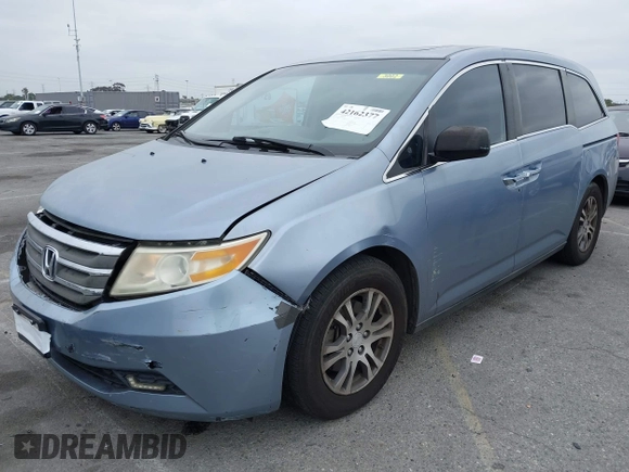 2012 Honda Odyssey EX-L with VIN 5FNRL5H66CB061847, listed as a IAAI auction lot 42162377 with 217,204 mi miles and . Bid and sale history available at DreamBid. Image 2.