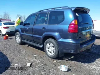 2005 Lexus GX with VIN JTJBT20XX50081621, listed as a IAAI auction lot 41661384 with 208,071 mi miles. Bid and sale history available at carsss.com. Image 3.