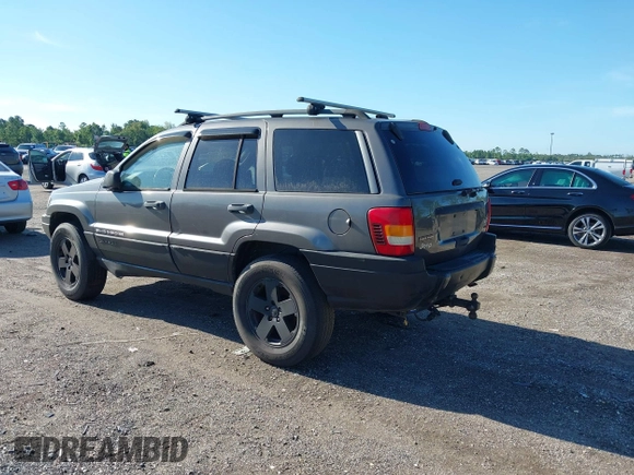 2002 Jeep Grand Cherokee z VIN 1J4GX38S32C238339, wystawiony jako IAAI lot #42653341 z przebiegiem 264 189 mil mil oraz . Historia ofert i sprzedaży dostępna na DreamBid. Obrazek 3.
