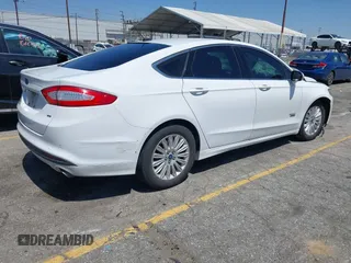 2016 Ford Fusion Energi SE Luxury with VIN 3FA6P0PU7GR206589, listed as a IAAI auction lot 42002565 with 215,789 mi miles. Bid and sale history available at carsss.com. Image 4.