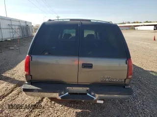 1999 Chevrolet Suburban with VIN 1GNFK16R4XJ483035, listed as a Copart auction lot 76666034 with 215,048 mi miles and Clean Title. Bid and sale history available at carsss.com. Image 6.