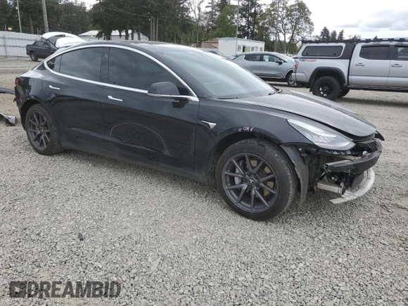 2019 Tesla Model 3 Mid Range z VIN 5YJ3E1EAXKF422500, wystawiony jako Copart lot #56065665 z przebiegiem 72 781 mil mil oraz Szkoda całkowita • Salvage title. Historia ofert i sprzedaży dostępna na DreamBid. Obrazek 4.
