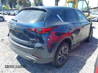 2023 Mazda CX-5 S Premium with VIN JM3KFBDM4P0185865, listed as a IAAI auction lot 42040234 with 32,761 mi miles and . Bid and sale history available at DreamBid. Image 4.
