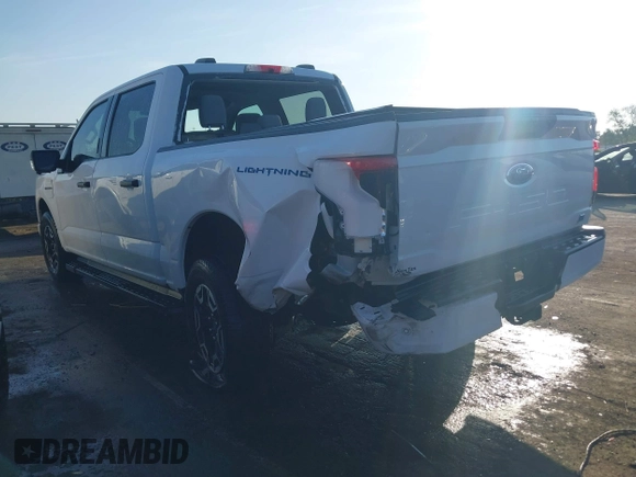 2023 Ford F-150 Lightning Pro with VIN 1FTVW1EL6PWG34059, listed as a IAAI auction lot 42010900 with 20,759 mi miles and . Bid and sale history available at DreamBid. Image 3.