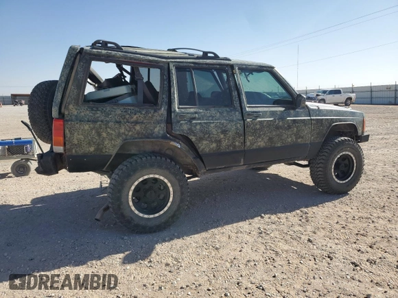 1999 Jeep Cherokee Sport with VIN 1J4FF68S6XL645028, listed as a Copart auction lot 48897255 with 218,552 mi miles and Salvage Title. Bid and sale history available at carsss.com. Image 3.