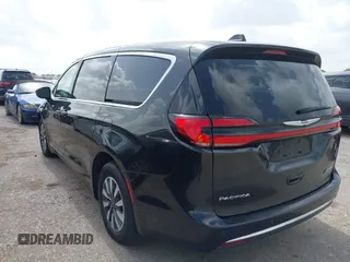 2023 Chrysler Pacifica Hybrid Touring L with VIN 2C4RC1L75PR611901, listed as a IAAI auction lot 42626500 with 44,156 mi miles and . Bid and sale history available at DreamBid. Image 3.
