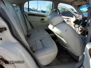 1999 Lincoln Town Car Signature z VIN 1LNHM82W9XY692757, wystawiony jako Copart lot #58091935 z przebiegiem 165 635 mil mil oraz Szkoda całkowita • Salvage title. Historia ofert i sprzedaży dostępna na DreamBid. Obrazek 10.