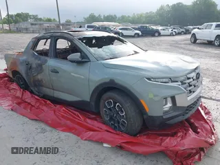 2023 Hyundai Santa Cruz SEL z VIN 5NTJCDAE1PH049512, wystawiony jako IAAI lot #41359680 z przebiegiem Nie podano mil oraz . Historia ofert i sprzedaży dostępna na DreamBid. Obrazek 1.