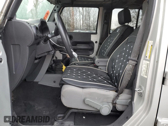 2007 Jeep Wrangler Unlimited X with VIN 1J4GA39177L105582, listed as a Copart auction lot 88912935 with 156,156 mi miles and Salvage Title. Bid and sale history available at DreamBid. Image 7.