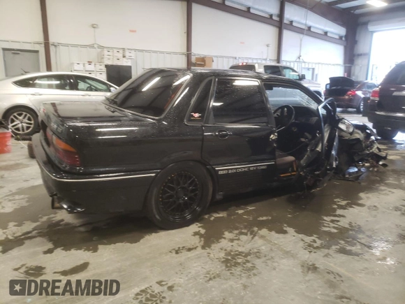 1988 Mitsubishi Galant with VIN E39A0010917, listed as a Copart auction lot 44421775 with 14,813 mi miles and Salvage Title. Bid and sale history available at DreamBid. Image 3.