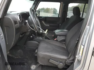 2015 Jeep Wrangler Unlimited Willys Wheeler with VIN 1C4BJWDG4FL723924, listed as a Copart auction lot 47145245 with 166,256 mi miles and Salvage Title. Bid and sale history available at DreamBid. Image 7.