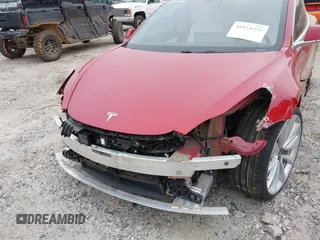 2018 Tesla Model 3 Long Range Battery with VIN 5YJ3E1EB7JF055384, listed as a IAAI auction lot 41924325 with 52,039 mi miles and . Bid and sale history available at DreamBid. Image 6.