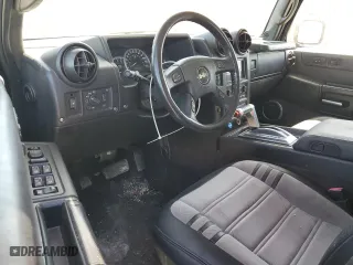 2005 Hummer H2 SUT with VIN 5GRGN22U65H113129, listed as a Copart auction lot 77315854 with 185,197 mi miles and Salvage Title. Bid and sale history available at carsss.com. Image 8.