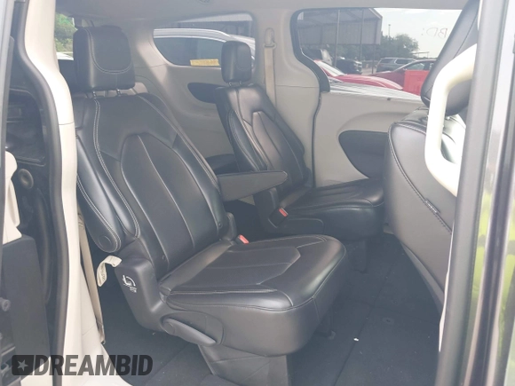 2023 Chrysler Pacifica Touring L with VIN 2C4RC1BG8PR594481, listed as a IAAI auction lot 42618839 with 60,748 mi miles and . Bid and sale history available at DreamBid. Image 8.
