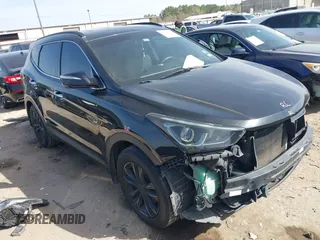 2018 Hyundai Santa Fe 2.0T z VIN 5NMZU4LA6JH083975, wystawiony jako IAAI lot #41795323 z przebiegiem 94 243 mil mil oraz . Historia ofert i sprzedaży dostępna na DreamBid. Obrazek 1.