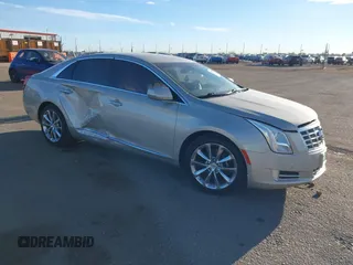 2014 Cadillac XTS Luxury z VIN 2G61N5S3XE9298471, wystawiony jako IAAI lot #41069292 z przebiegiem 92 112 mil mil oraz . Historia ofert i sprzedaży dostępna na DreamBid. Obrazek 1.
