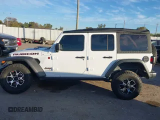 2022 Jeep Wrangler Unlimited Rubicon with VIN 1C4HJXFN4NW123803, listed as a IAAI auction lot 40994742 with 36,156 mi miles and . Bid and sale history available at DreamBid. Image 14.