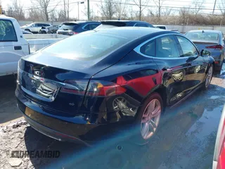 2013 Tesla Model S with VIN 5YJSA1CG2DFP14689, listed as a IAAI auction lot 41648508 with 98,578 mi miles and . Bid and sale history available at carsss.com. Image 4.