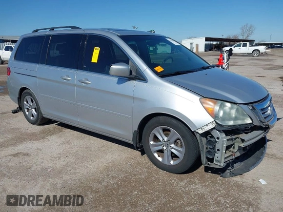 2010 Honda Odyssey Touring with VIN 5FNRL3H97AB015472, listed as a IAAI auction lot 41763680 with 144,309 mi miles. Bid and sale history available at carsss.com. Image 1.