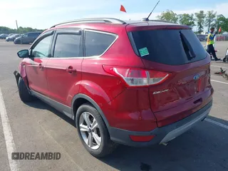 2014 Ford Escape SE z VIN 1FMCU0GX2EUB91517, wystawiony jako IAAI lot #42231093 z przebiegiem 67 436 mil mil oraz . Historia ofert i sprzedaży dostępna na DreamBid. Obrazek 3.