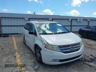 2012 Honda Odyssey Touring with VIN 5FNRL5H94CB124695, listed as a IAAI auction lot 42330836 with 193,466 mi miles and . Bid and sale history available at DreamBid. Image 1.