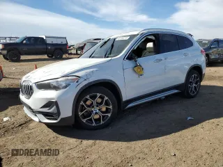 2020 BMW X1 sDrive28i with VIN WBXJG7C01L5P73297, listed as a Copart auction lot 48153215 with 60,946 mi miles and Salvage Title. Bid and sale history available at carsss.com. Image 1.