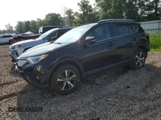 2018 Toyota RAV4 XLE with VIN 2T3RFREV0JW765995, listed as a Copart auction lot 63968785 with 114,598 mi miles and Salvage title. Bid and sale history available at DreamBid. Image 1.
