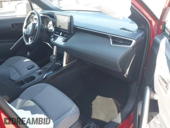 2023 Toyota Corolla Cross Hybrid S with VIN 7MUFBABG6PV008234, listed as a IAAI auction lot 41813661 with 1,127 mi miles and . Bid and sale history available at DreamBid. Image 5.