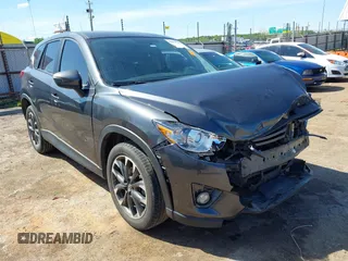 2016 Mazda CX-5 Grand Touring z VIN JM3KE2DY5G0861438, wystawiony jako IAAI lot #42170186 z przebiegiem 86 020 mil mil oraz . Historia ofert i sprzedaży dostępna na DreamBid. Obrazek 1.