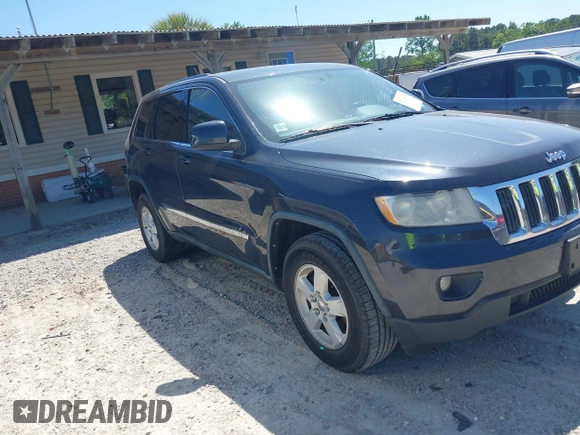 2012 Jeep Grand Cherokee Laredo with VIN 1C4RJEAG9CC223167, listed as a IAAI auction lot 42136098 with 152,715 mi miles. Bid and sale history available at carsss.com. Image 1.