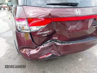 2014 Honda Odyssey Touring with VIN 5FNRL5H9XEB073156, listed as a IAAI auction lot 41990714 with 166,129 mi miles and . Bid and sale history available at DreamBid. Image 17.