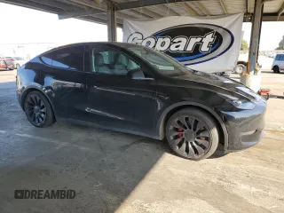 2022 Tesla Model Y Performance with VIN 7SAYGDEF5NF339965, listed as a Copart auction lot 62187545 with 93,156 mi miles and Salvage title. Bid and sale history available at DreamBid. Image 4.