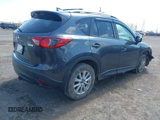 2016 Mazda CX-5 Touring with VIN JM3KE4CYXG0620990, listed as a IAAI auction lot 41978738 with 91,237 mi miles and . Bid and sale history available at carsss.com. Image 4.