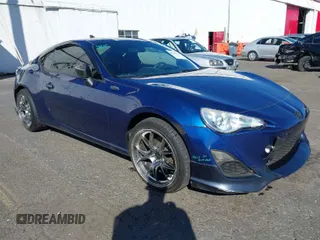 2013 Scion FR-S with VIN JF1ZNAA11D2702415, listed as a IAAI auction lot 40381041 with 63,581 mi miles. Bid and sale history available at carsss.com. Image 1.