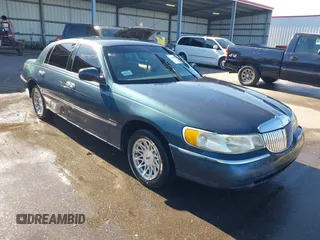 1998 Lincoln Town Car Signature with VIN 1LNFM82W1WY730200, listed as a IAAI auction lot 41443774 with 269,446 mi miles and . Bid and sale history available at DreamBid. Image 1.