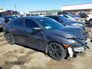 2019 Honda Civic Sport with VIN 19XFC2F82KE019704, listed as a IAAI auction lot 41770051 with 90,011 mi miles and . Bid and sale history available at DreamBid. Image 13.