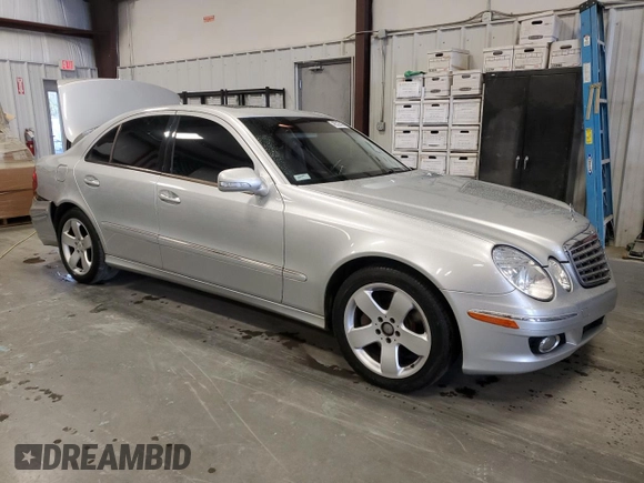 2007 Mercedes-Benz E 550 with VIN WDBUF72X97B017766, listed as a Copart auction lot 48523515 with 299,578 mi miles and Salvage Title. Bid and sale history available at DreamBid. Image 4.