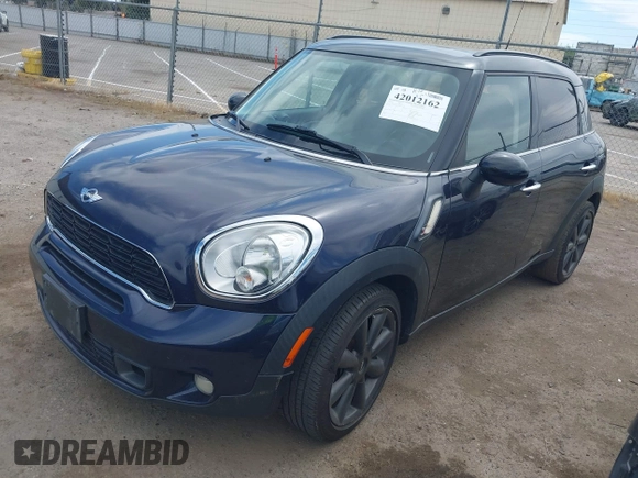2014 MINI Countryman S with VIN WMWZC3C54EWP26131, listed as a IAAI auction lot 42012162 with 125,869 mi miles and . Bid and sale history available at DreamBid. Image 2.