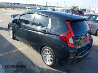 2015 Honda Fit LX z VIN 3HGGK5H57FM717203, wystawiony jako IAAI lot #41615075 z przebiegiem 99 933 mil mil oraz . Historia ofert i sprzedaży dostępna na DreamBid. Obrazek 3.
