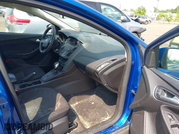 2018 Ford Focus SE z VIN 1FADP3FE1JL254632, wystawiony jako IAAI lot #42408683 z przebiegiem 74 696 mil mil oraz . Historia ofert i sprzedaży dostępna na DreamBid. Obrazek 5.