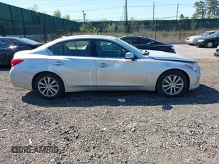 2015 Infiniti Q50 with VIN JN1BV7AR3FM416371, listed as a IAAI auction lot 42036139 with 76,239 mi miles and . Bid and sale history available at DreamBid. Image 13.
