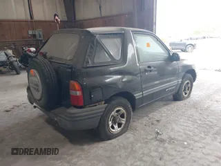 1999 Chevrolet Tracker z VIN 2CNBE18CXX6919189, wystawiony jako IAAI lot #42196856 z przebiegiem Nie podano mil oraz . Historia ofert i sprzedaży dostępna na DreamBid. Obrazek 4.