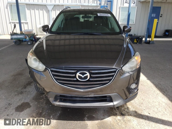2016 Mazda CX-5 Touring z VIN JM3KE2CY4G0805072, wystawiony jako Copart lot #58435535 z przebiegiem 146 323 mil mil oraz Szkoda całkowita • Salvage title. Historia ofert i sprzedaży dostępna na DreamBid. Obrazek 5.