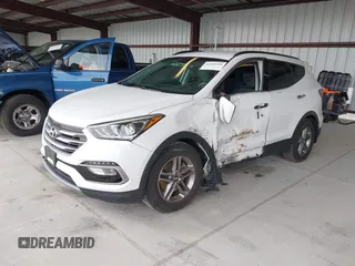 2018 Hyundai Santa Fe 2.4L z VIN 5NMZU3LB9JH083018, wystawiony jako IAAI lot #42205310 z przebiegiem 65 504 mil mil oraz . Historia ofert i sprzedaży dostępna na DreamBid. Obrazek 2.